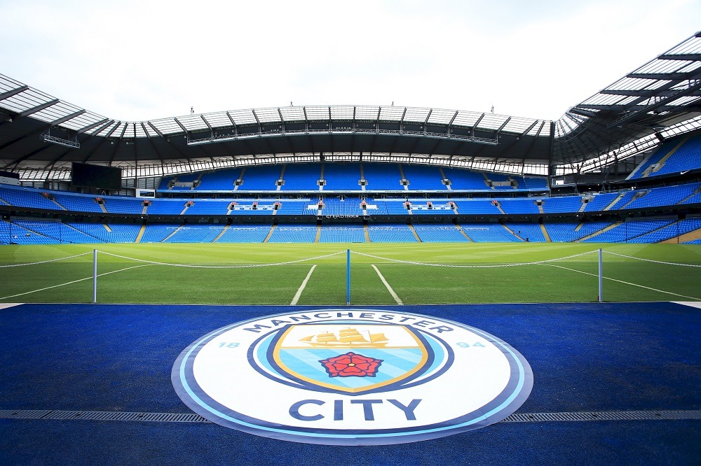 Manchester Citys crest is on display in the Etihad Stadium